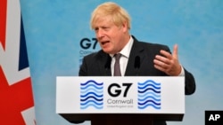 Britain's Prime Minister Boris Johnson during a press conference on the final day of the G7 summit in southwestern England on June 13.