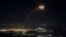 Rockets fired from southern Lebanon are intercepted by Israel's Iron Dome air-defense system over the Upper Galilee region in northern Israel on August 4.