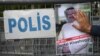 A protester holds a picture of missing journalist Jamal Khashoggi during a demonstration in front of the Saudi Arabian Consulate in Istanbul on October 5.