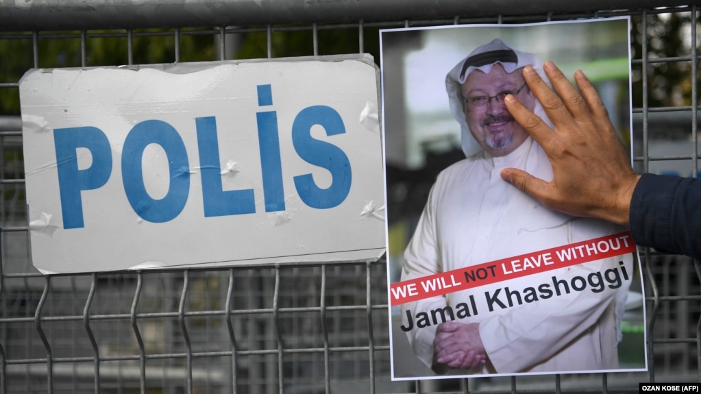 A protestor holds a picture of missing journalist Jamal Khashoggi during a demonstration in front of the Saudi Arabian consulate, on October 5, 2018 in Istanbul.