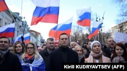 Алексей Навальный и его соратники на марше памяти оппозиционного политика Бориса Немцова, застреленного в центре Москвы, февраль 2020 года
