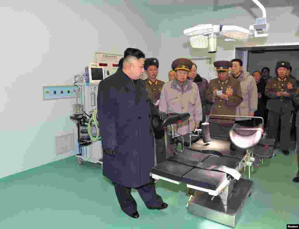 North Korean leader Kim Jong Un (front) visits the Taesongsan General Hospital being built by the People&#39;s Army in Pyongyang in this picture released by North Korea&#39;s KCNA news agency. KCNA said the hospital covers a total plot of more than 100,000 square meters and has three sick wards. (Reuters/KCNA)