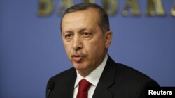 Turkish Prime Minister Tayyip Erdogan has slammed a French bill that would make it a crime to deny that Ottoman massacres of Armenians were genocide.