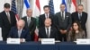 Američki državni sekretar Marko Rubio (u sredini, pozadi) posmatra kako izraelski ambasador u SAD Jehiel Lajter, šef kabineta Stejt departmenta Danijel Holer i libanska ambasadorka u SAD Nada Hamadeh potpisuju okvirni sporazum u Vašingtonu 26. juna 2026.