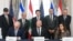 US Secretary of State Marco Rubio (center, back) looks on as Israeli Ambassador to the US Yechiel Leiter, State Department Chief of Staff Daniel Holler, and Lebanese Ambassador to the US Nada Hamadeh sign a framework agreement in Washington, D.C. on June 26.