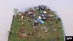 A plot of land is surrounded by floodwaters in Rantau Panjang, Malaysia, in November 2009.