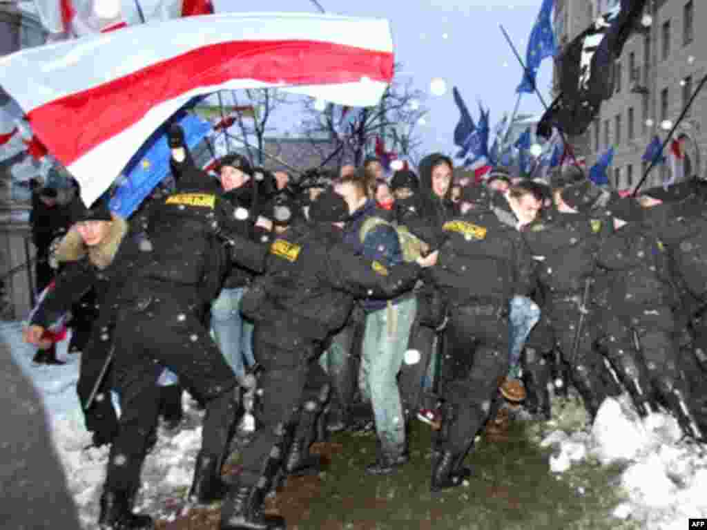 In Belarus special police forces detain protesters during an opposition rally in Minsk. - Belarus's special police forces detain protesters during an opposition rally in Minsk on March 25, 2008. Dozens of opposition activists were detained in the capital of Belarus on Tuesday as police beat protesters attempting to mark a nationalist holiday.