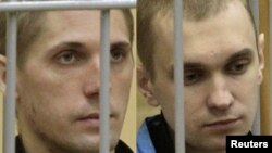 A combo photo of Uladzislau Kavalyou (left) and Dzmitry Kanavalau during a court hearing in Minsk in September 2011.