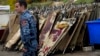 A policeman walks past blood-stained stretchers at a morgue in Stepanakert, the main city in Nagorno-Karabakh, on November 6.