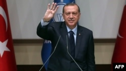 Turkish President Recep Tayyip Erdogan delivers a speech at the headquarters of the ruling AKP in Ankara on May 2.