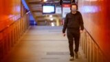 A lone passenger wearing a protective face mask walks from a deserted train platform at Flinders Street during morning commute hours on the first day of a lockdown as the state of Victoria looks to curb the spread of a coronavirus disease (COVID-19) outbr