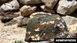 Armenia -- A military helmet, undated