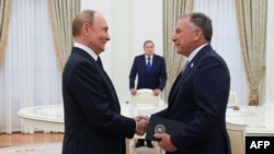 In this pool photograph distributed by the Russian state agency Sputnik, Russia's President Vladimir Putin greets US Special Envoy Steve Witkoff prior to their talks in Moscow on August 6.