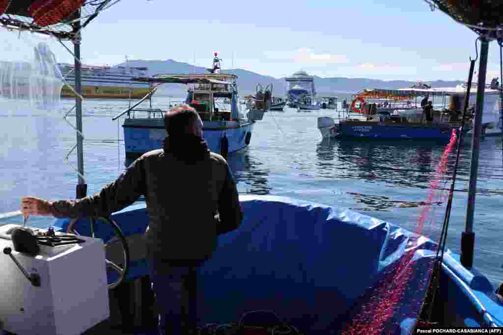 A fisherman who is taking part in a blockade of the port of Ajaccio, on the French island of Corsica, on April 7.Seamen from the island were protesting the "deadly spiral" of fuel prices, which are higher than on the French mainland.