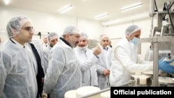 Armenia -- Prime Minister Nikol Pashinian (second from left) visits a new cheese factory opened by the Spayka company in Yerevan, March 26, 2019.