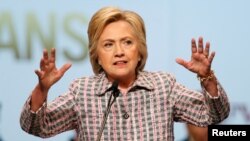 U.S. Democratic presidential candidate Hillary Clinton gestures as she speaks at the Veterans of Foreign Wars Convention in Charlotte, North Carolina, on July 25.