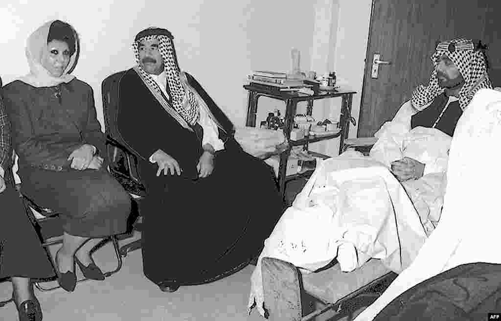 Saddam Hussein and his wife, Sajida, visit their son, Uday, after a failed assassination attempt on him in 1996. Uday was shot eight times which left him partially handicapped. Along with his brother, Qusay, he played a brutal role in the regime before being killed by U.S.-led forces in 2003.