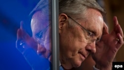 U.S.Democratic Senate Majority Leader Harry Reid awaits the countdown to midnight when the government was to shut down. 