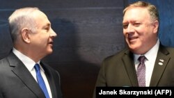 Israeli Prime Minister Benjamin Netanyahu (left) and U.S. Secretary of State Mike Pompeo talk to the press on the sidelines of a session at the conference in Warsaw on February 14.