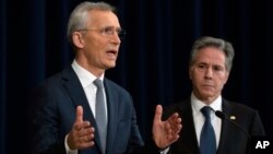 U.S. Secretary of State Antony Blinken (right) listens as NATO Secretary-General Jens Stoltenberg speaks during a news conference at the State Department in Washington on January 29.