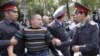 Police detain a protester during an opposition rally in Bishkek.