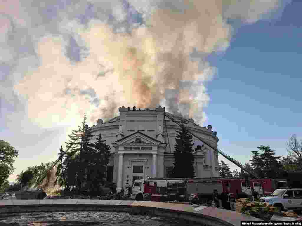 The building that housed the Siege of Sevastopol panorama burns after a drone strike in the early hours of June 10, which the Crimean city's Russian-occupation authorities blamed on Kyiv.Images showing charred and water-logged sections of the panorama, one of Crimea's most famous artworks, appear to confirm it was severely damaged by the strike.