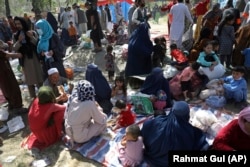 Internally displaced Afghans from Kunduz Province, who fled their homes due to fighting between the Taliban and Afghan security personnel, take refuge in a public park in Kabul on August 9.