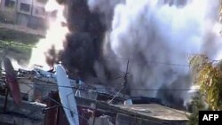 A video allegedly shows shelling by army tanks of the residential area of Bab Amr in the protest hub of Homs on February 17.