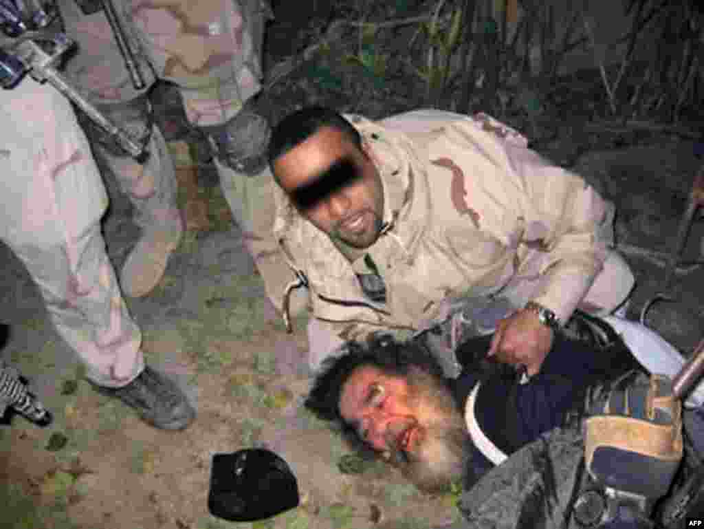 The capture of Saddam Hussein, December 13, 2003. U.S. forces found him living underground in a so-called "spider hole" with scant space and spartan facilities.