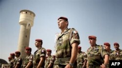 French paratroopers from the 8th Regiment march as they await the arrival of President Nicolas Sarkozy at Camp Warehouse in Kabul last year.