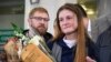 Maria Butina, who served nine months in a U.S. prison for acting as a Russian government agent, arrives at Moscow's Sheremetyevo airport on October 26, a day after her release. 