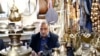 An Iranian man sits in his shop at the old bazaar in the city of Qazvin, Iran, October 2016