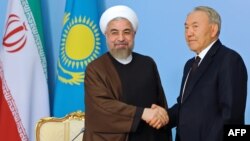 Қазақстан президенті Нұрсұлтан Назарбаев (оң жақта) пен Иран президенті Хассан Роухани. Астана, 9 қыркүйек 2014 жыл.