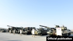 Azerbaijan - Russian-made tanks and artillery systems are put on display during exercises conducted by the Azerbaijani army, 26Jun2014.