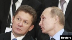 Рускиот претседател Владимир Путин со директорот на Газпром Алексеј Милер