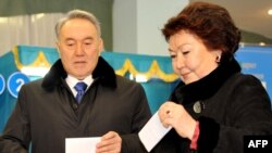 Sara Nazarbaeva (right) votes with her husband, President Nursultan Nazarbaev, in Astana in April.