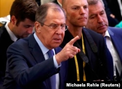 Russian Foreign Minister Sergei Lavrov gesticulates at the Munich Security Conference.