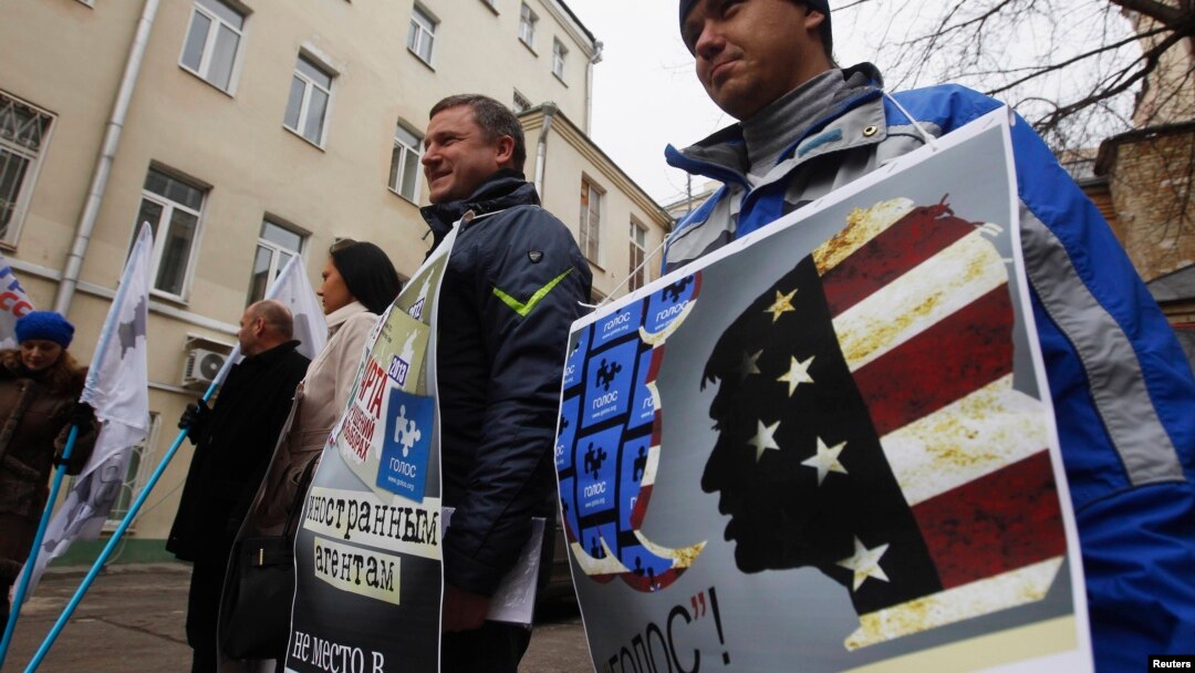 Russian protesters outside the office of the election-monitoring NGO Golos in Moscow accuse the group of foreign ties. Rodger Potocki says the NED doesn't "ascribe to this idea that there are phrases or approaches that are foreign or domestic, that are internal or external." 