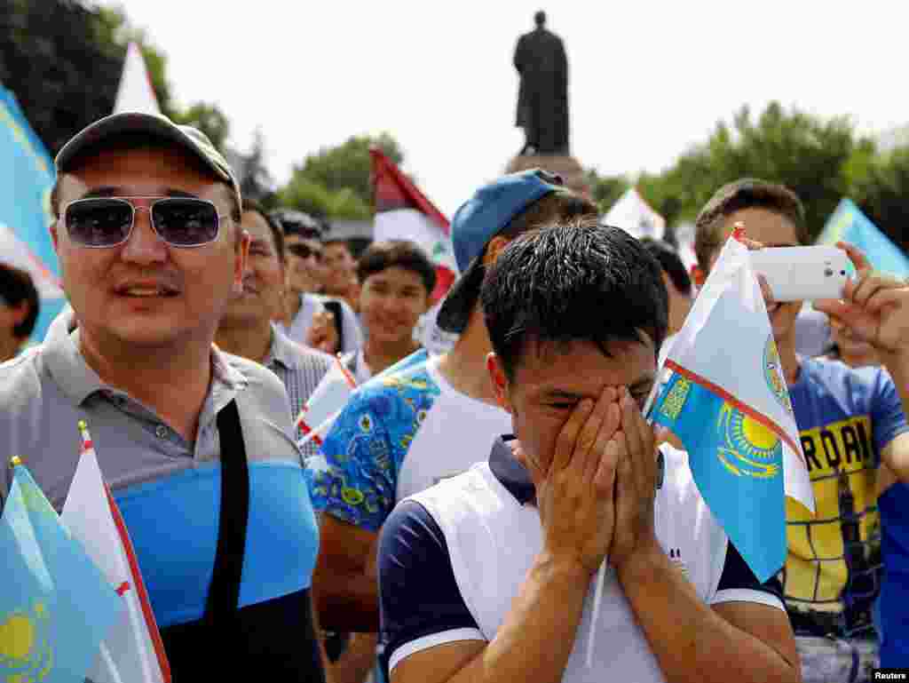 Supporters of Almaty&#39;s candidacy for the 2022 Winter Olympic Games react after the announcement that Almaty had been eliminated from the International Olympic Committee&#39;s voting process to select the host city, in Almaty on July 31. (Reuters/Shamil Zhumatov)