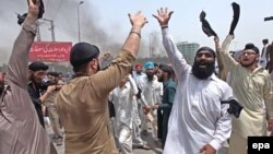 FILE: Members of minority Sikh community shout protest in the northwestern city of Peshawar.