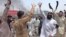 FILE: Members of minority Sikh community shout protest in the northwestern city of Peshawar.