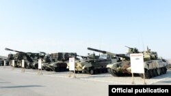 Azerbaijan - Russian-made tanks and artillery systems are put on display during exercises conducted by the Azerbaijani army, 26Jun2014.