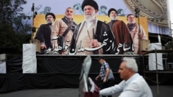 A billboard in Tehran depicts Iran's late Supreme Leader Ayatollah Ali Khamenei, late former Hezbollah leader Hassan Nasrallah, and late military commander Qassem Soleimani, on October 6.