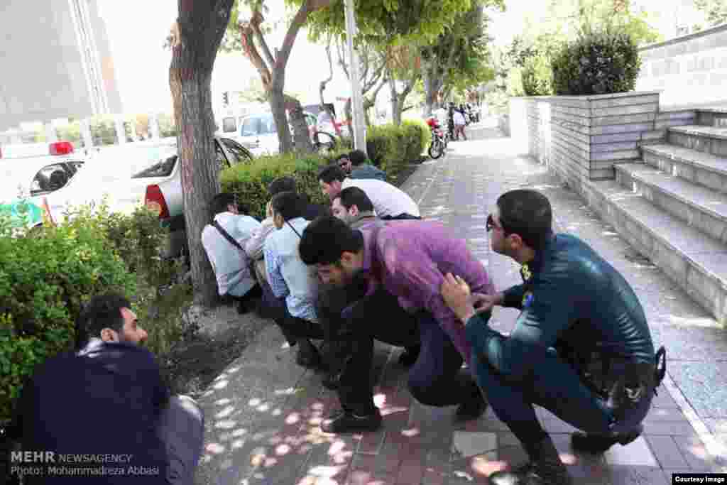 Police and civilians near parliament take cover as shots ring out.&nbsp;