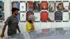 تصاویری از نامزدهای انتخابات، نفش بسته بر دیوار خیابانی در تونس