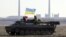 Ukraine – Ukrainian servicemen drive on an APC (Armoured Personnel Carrier) on a field close to the checkpoint near village Roty, not far from the eastern Ukrainian city of Debaltseve, Donetsk area, 22 February 2015