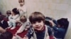 ROMANIA -- Romanian orphans pass away their hours without toys at Bucharest's Number One Orphanage in Bucharest, Romania, February 14, 1991.