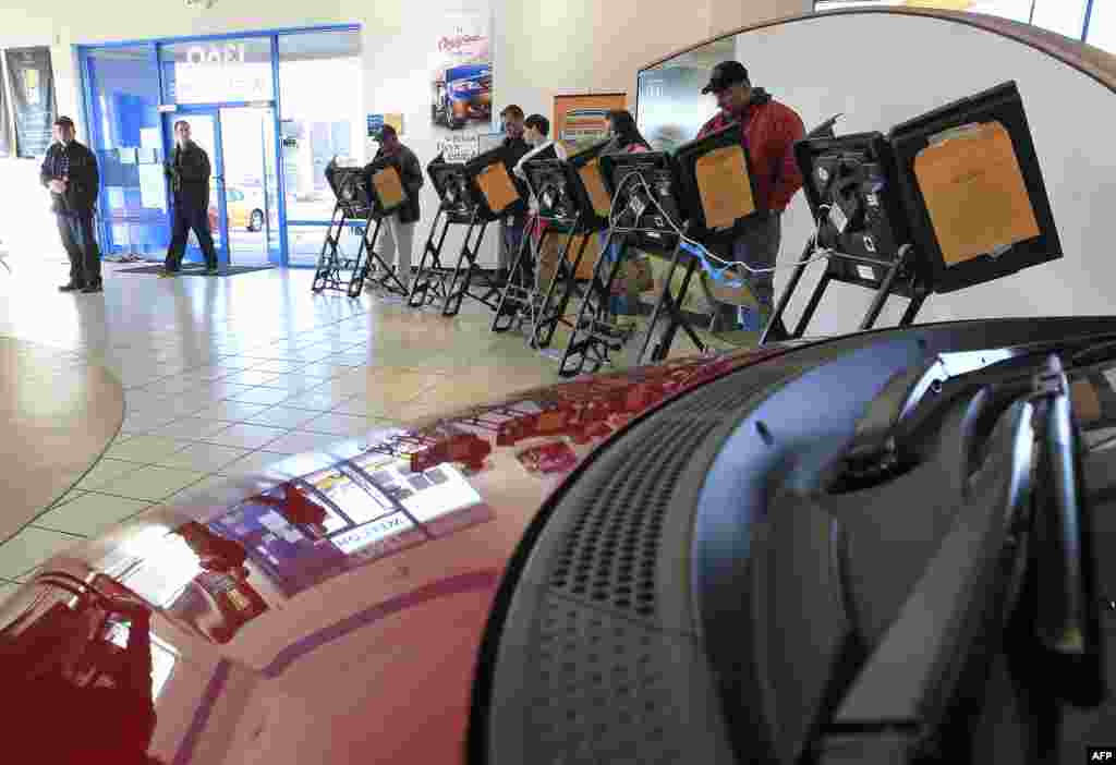 Voters at the polls in a car dealership in Columbus, Ohio.