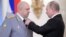 Russian President Vladimir Putin (right) decorates Colonel General Sergei Surovikin (left) during a ceremony at the Kremlin to present state awards to Russian soldiers who fought in Syria in December 2017.