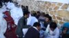 University students during the seventh day of their hunger strike near parliament in Kabul on May 26